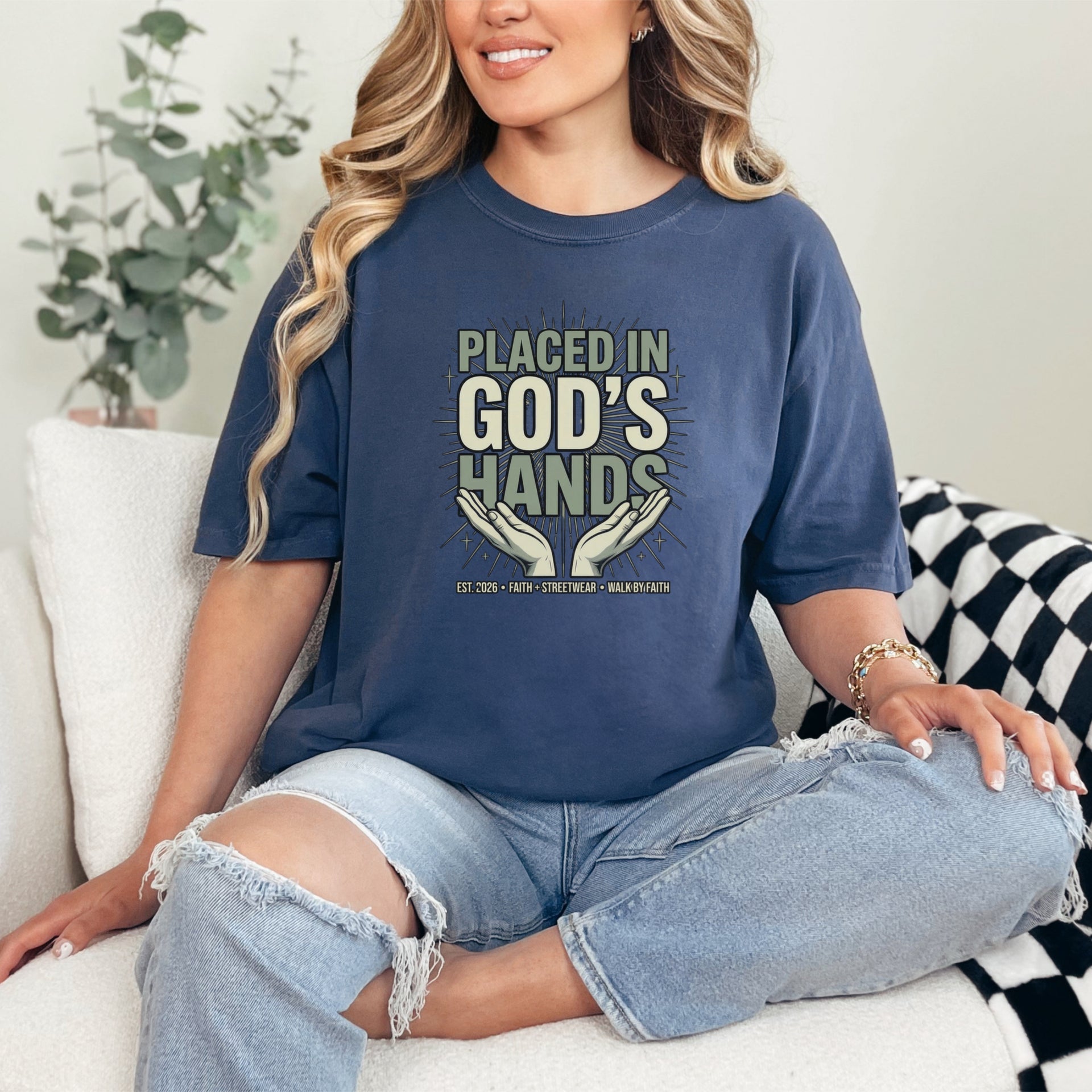 Model wearing Placed in God's Hands T-Shirt, showcasing its comforting message and stylish design.