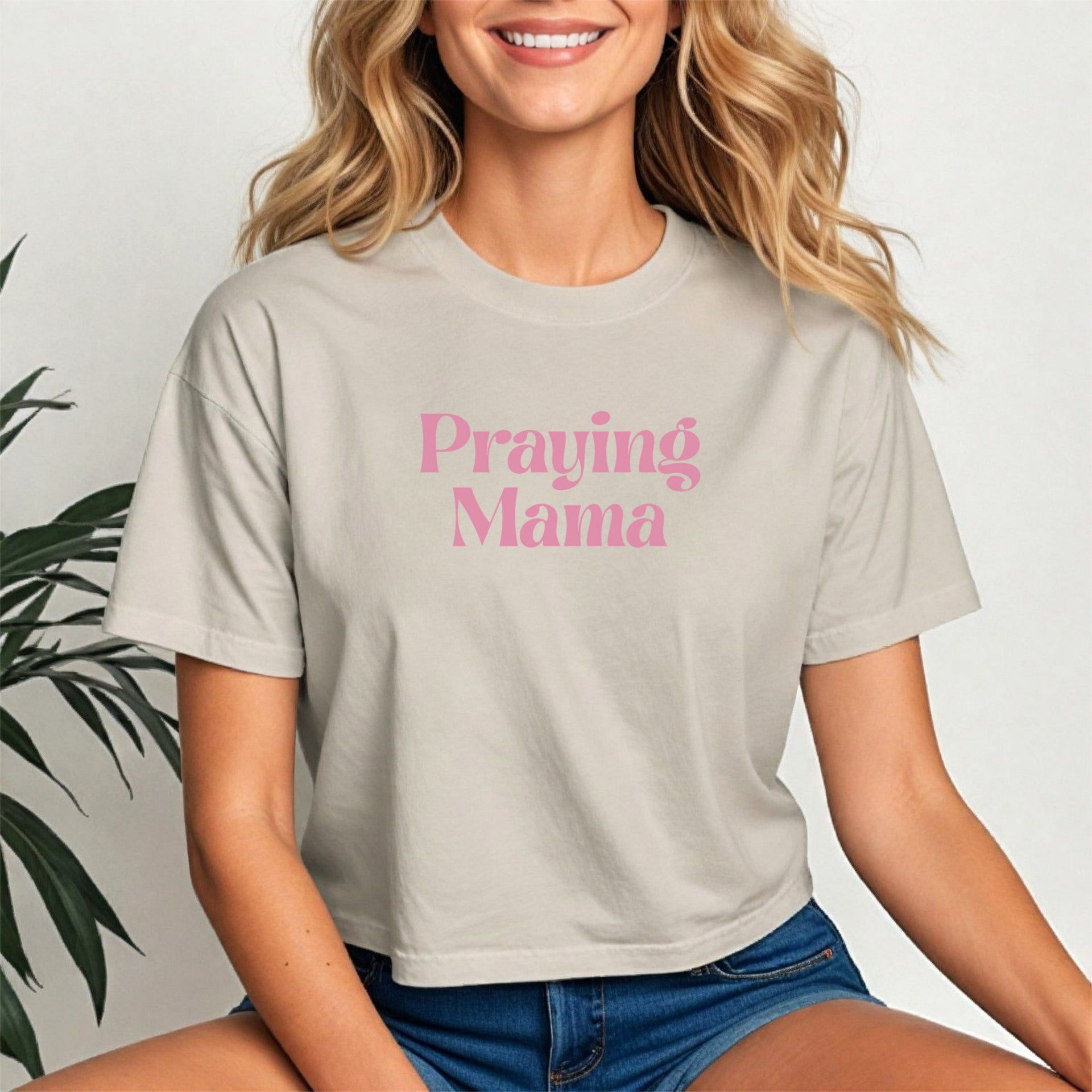 Praying Mama Crop Tee featuring a stylish script design on a soft, breathable cropped shirt for moms of faith.