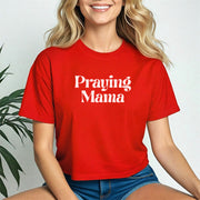 Model wearing a red Praying Mama Crop Tee, showcasing faith and style with a trendy cropped fit.