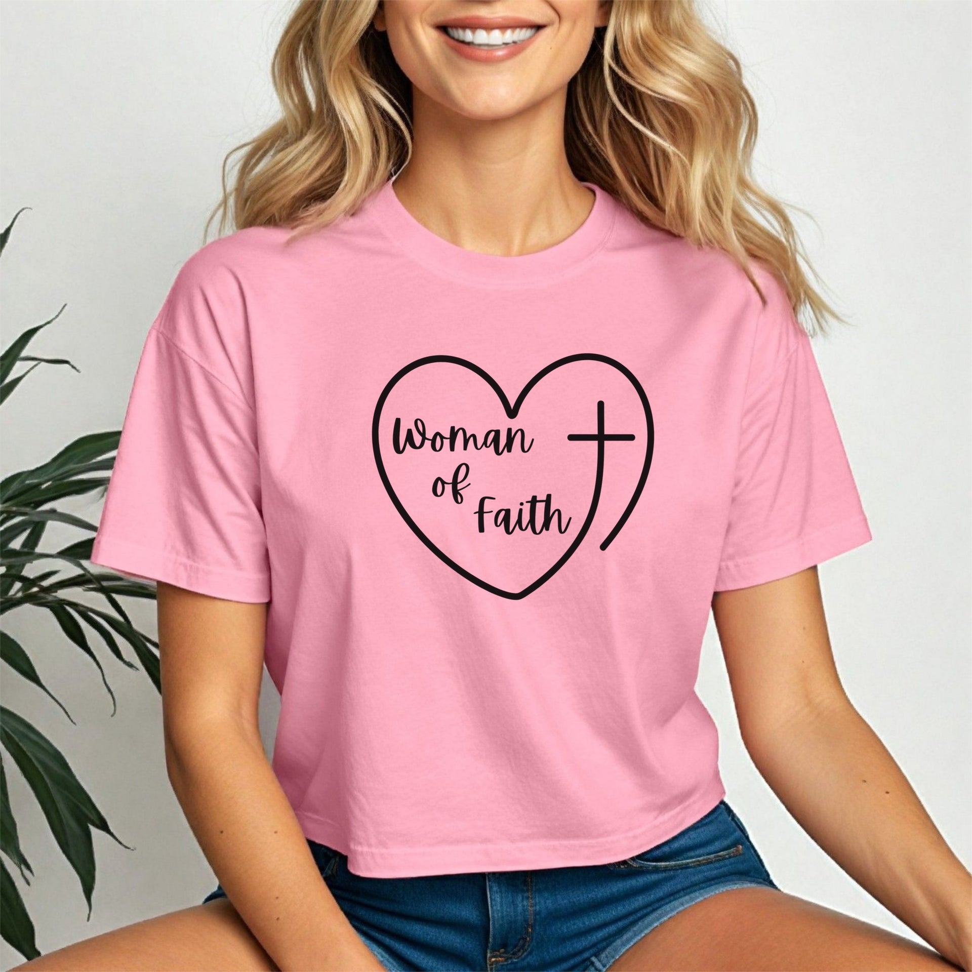 Woman Of Faith Heart Cross Crop Tee in pink featuring heart and cross design, perfect for expressing faith and style.