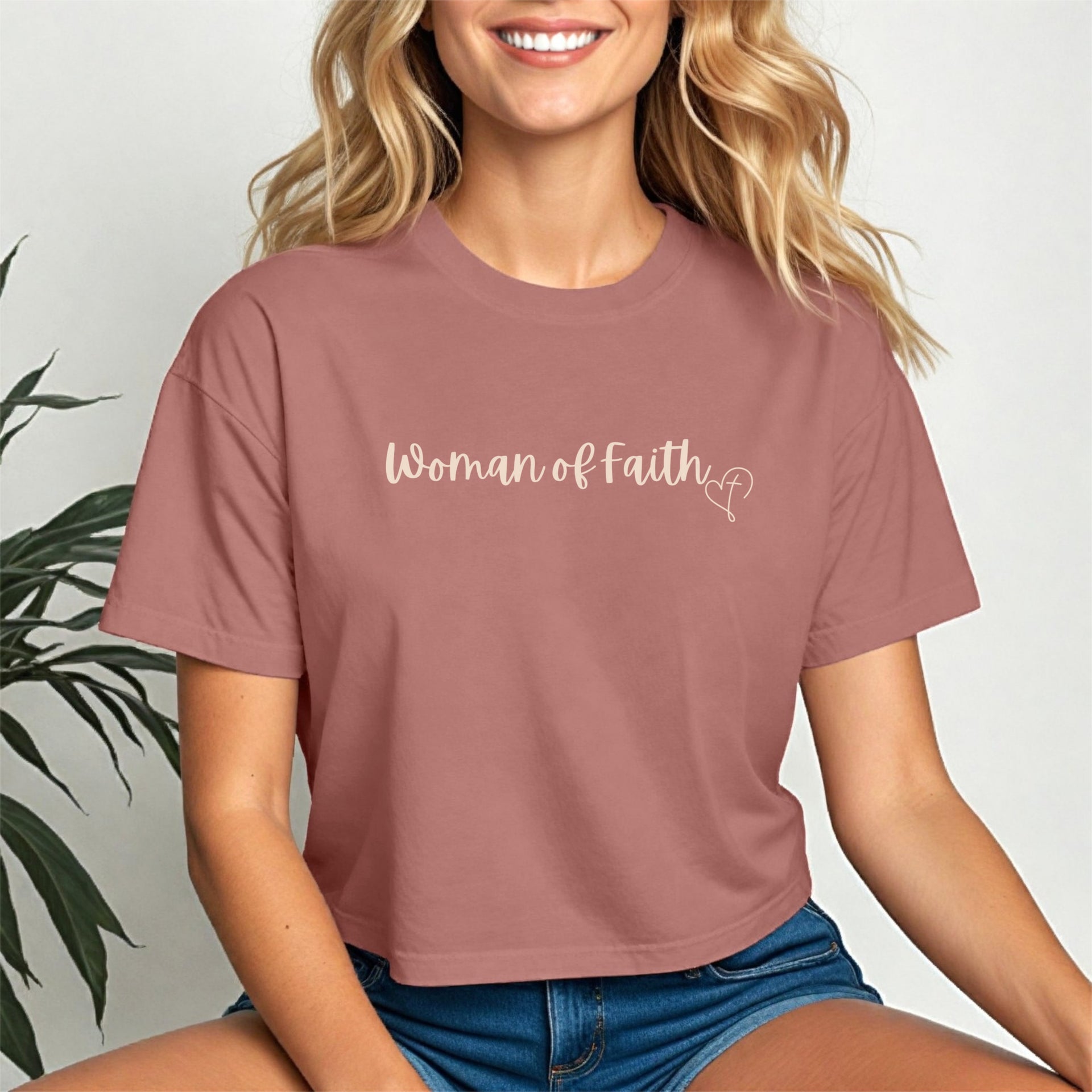 Woman Of Faith Crop Tee worn by a smiling woman in a trendy cropped design, showcasing belief and style.