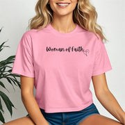 Model wearing a pink Woman Of Faith Crop Tee, showcasing its stylish design and comfortable fit.