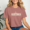 Model wearing the Redeemed Cross Graphic Crop Tee with a cross design, showcasing stylish faith-inspired fashion.