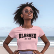 Blessed John 20 29 Crop Tee worn by model at the beach, showcasing trendy design and soft fabric.