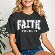 Faith Ephesians 2 8 Crop Tee worn by a smiling woman, featuring bold text design on a black cropped t-shirt.