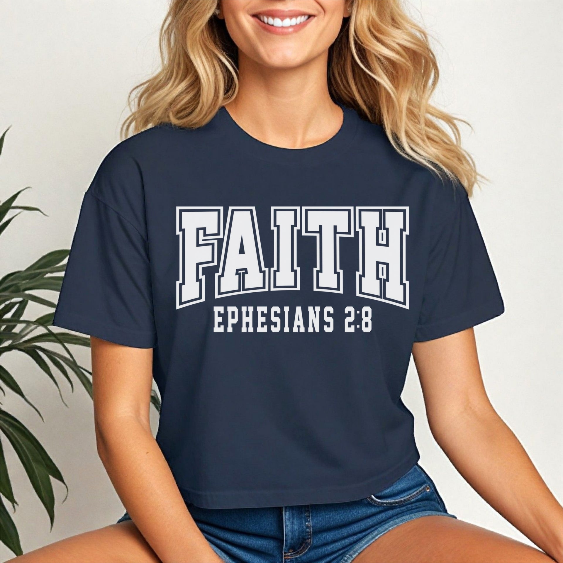 Faith Ephesians 2 8 Crop Tee in navy blue worn by a smiling woman, highlighting a trendy and faith-inspired design.
