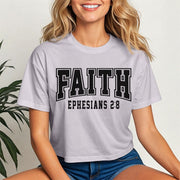Faith Ephesians 2 8 Crop Tee displayed on a model, highlighting trendy design and scripture-inspired message.
