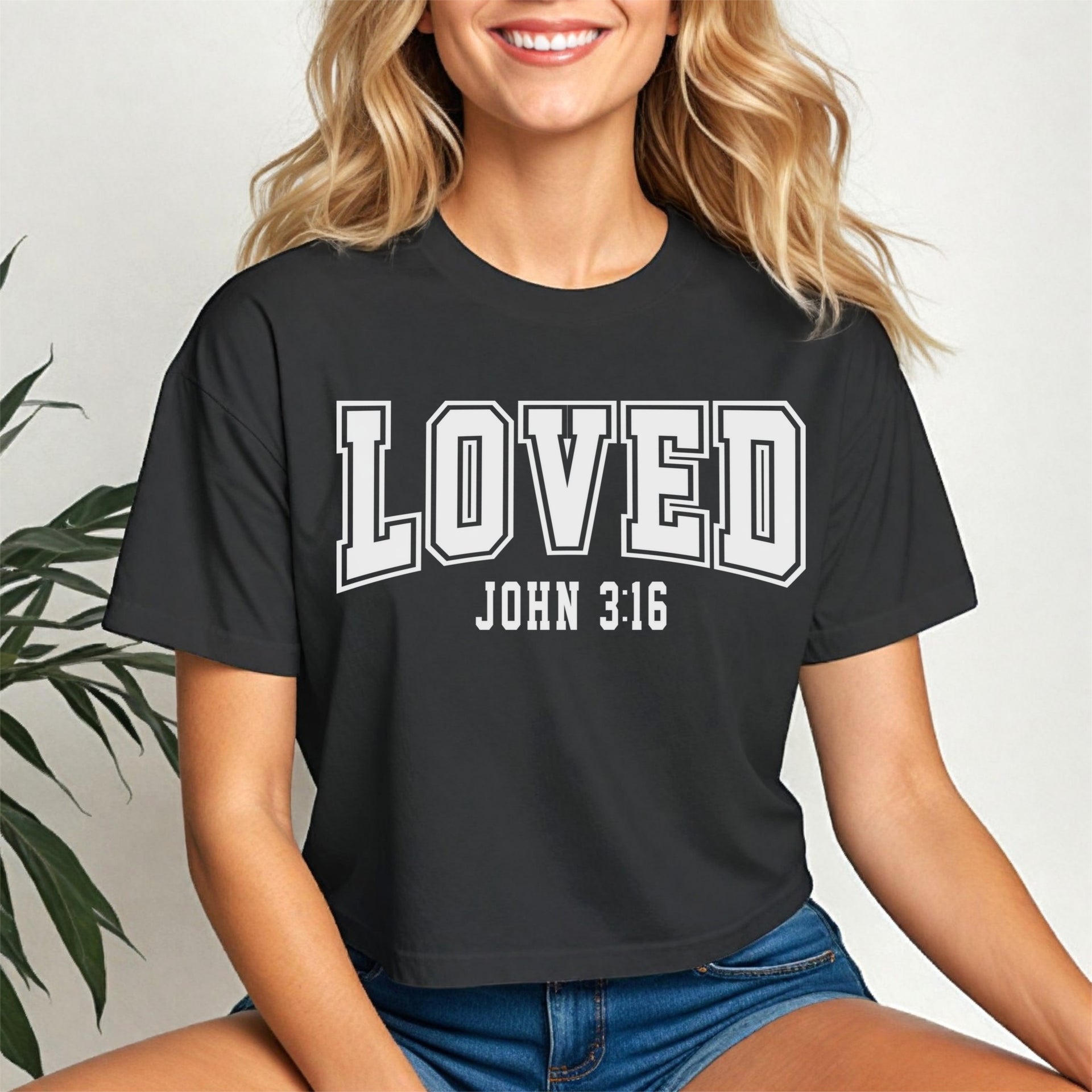 Loved John 3 16 Crop Tee displayed on a model, featuring a trendy black crop design with the text Loved John 3:16.