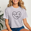 Woman Of Faith Heart Cross Crop Tee featuring a heart and cross design on a light fabric.