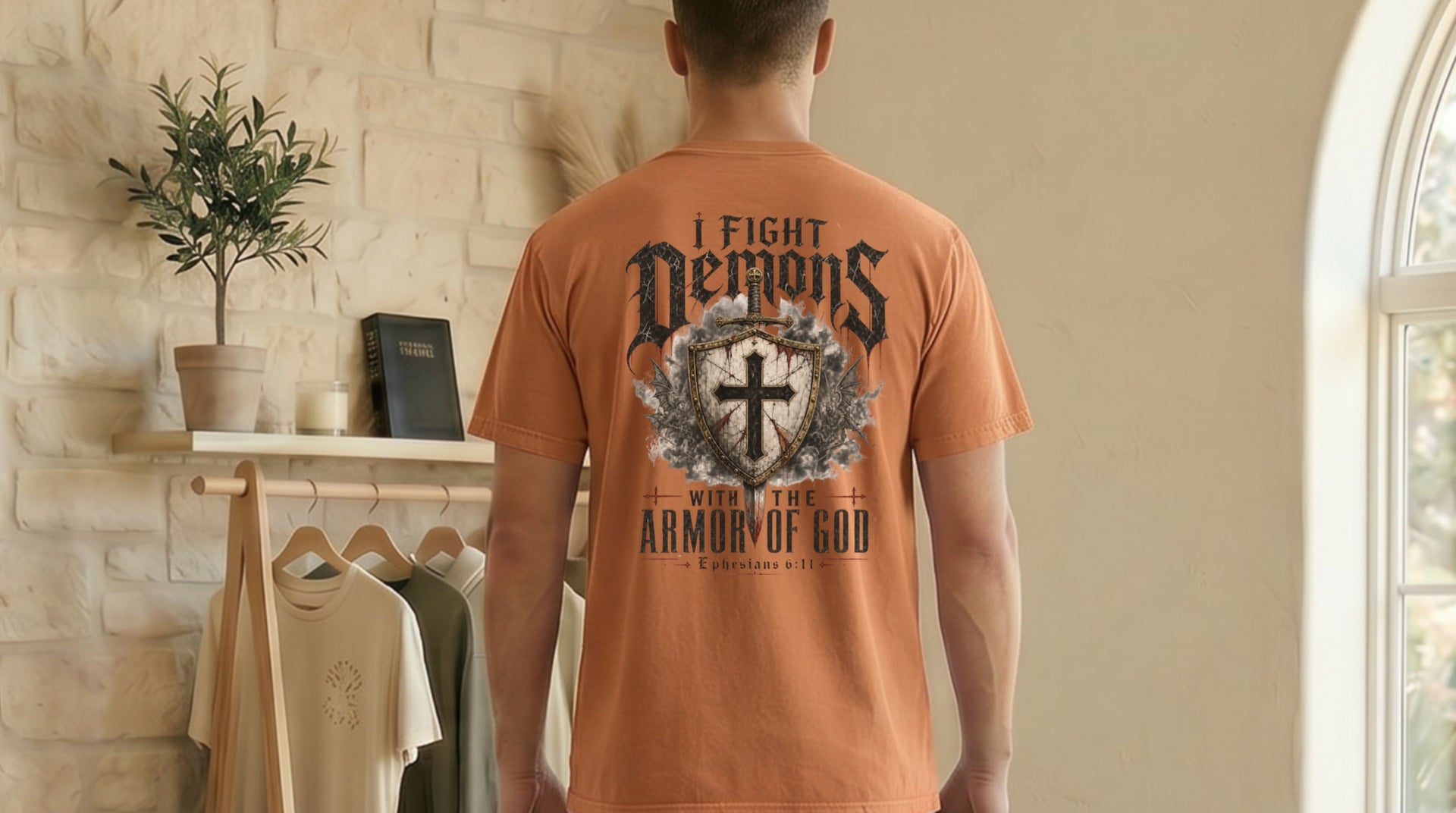 Model wearing I Fight Demons Armor Of God Ephesians 6-11 Comfort Colors T Shirt in a stylish setting.