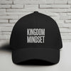 Kingdom Mindset Embroidered Flexfit Hat displayed against a brick wall background.