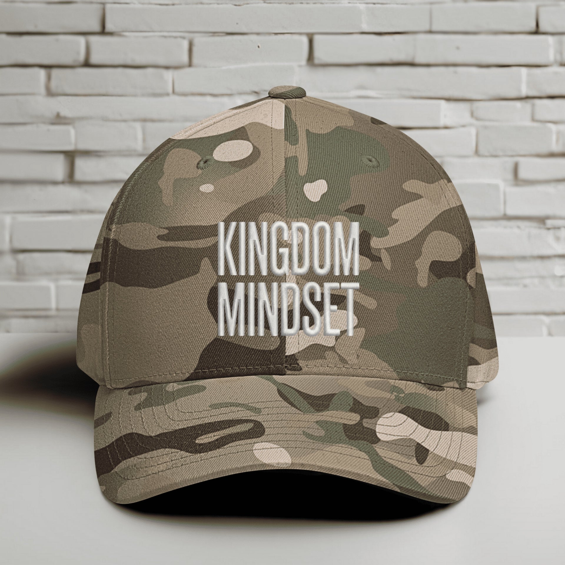Kingdom Mindset Embroidered Flexfit Hat in camouflage design, showcasing faith and focus.
