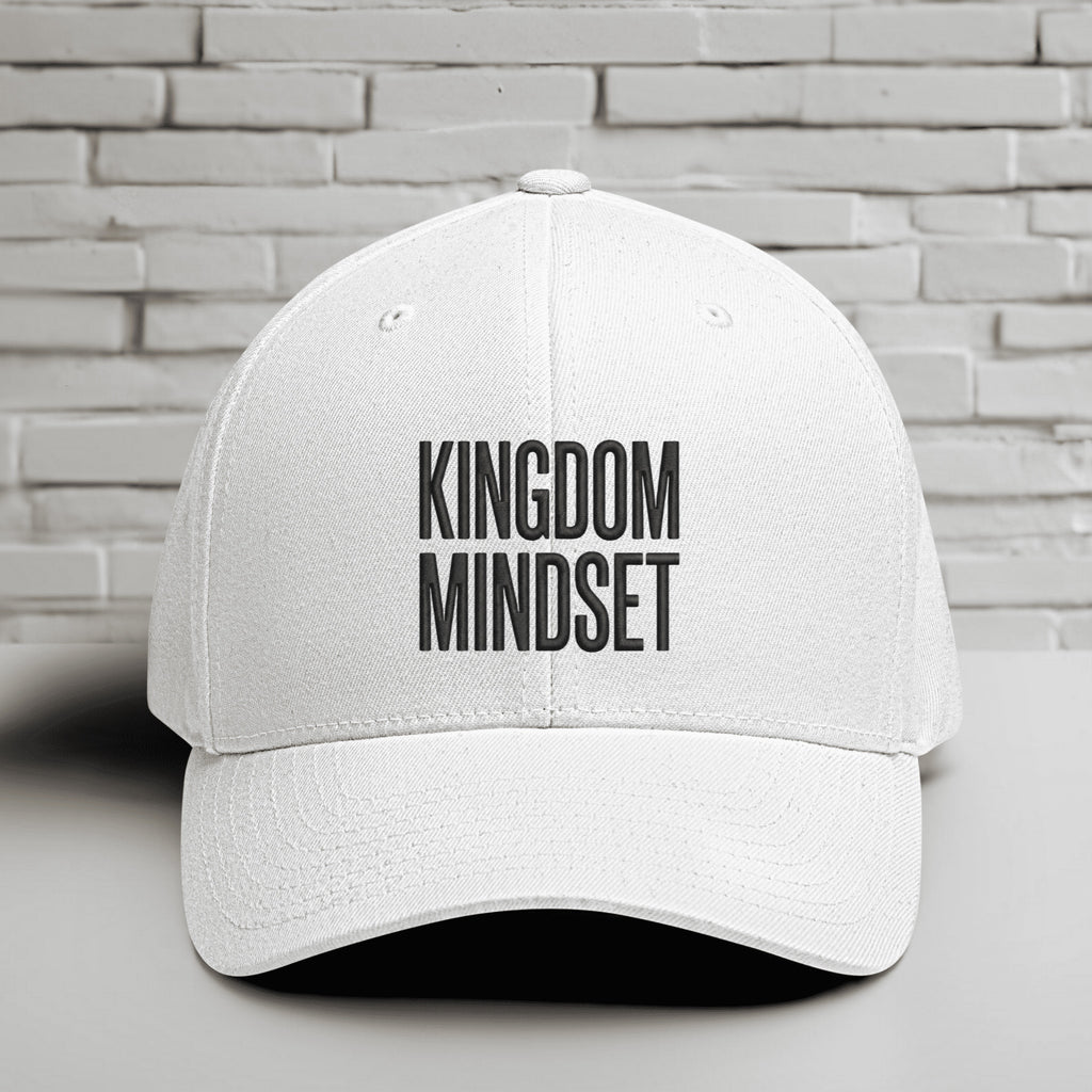 Kingdom Mindset Embroidered Flexfit Hat featuring a clean white design with bold text representing faith and intention.