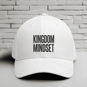 Kingdom Mindset Embroidered Flexfit Hat featuring a clean white design with bold text representing faith and intention.