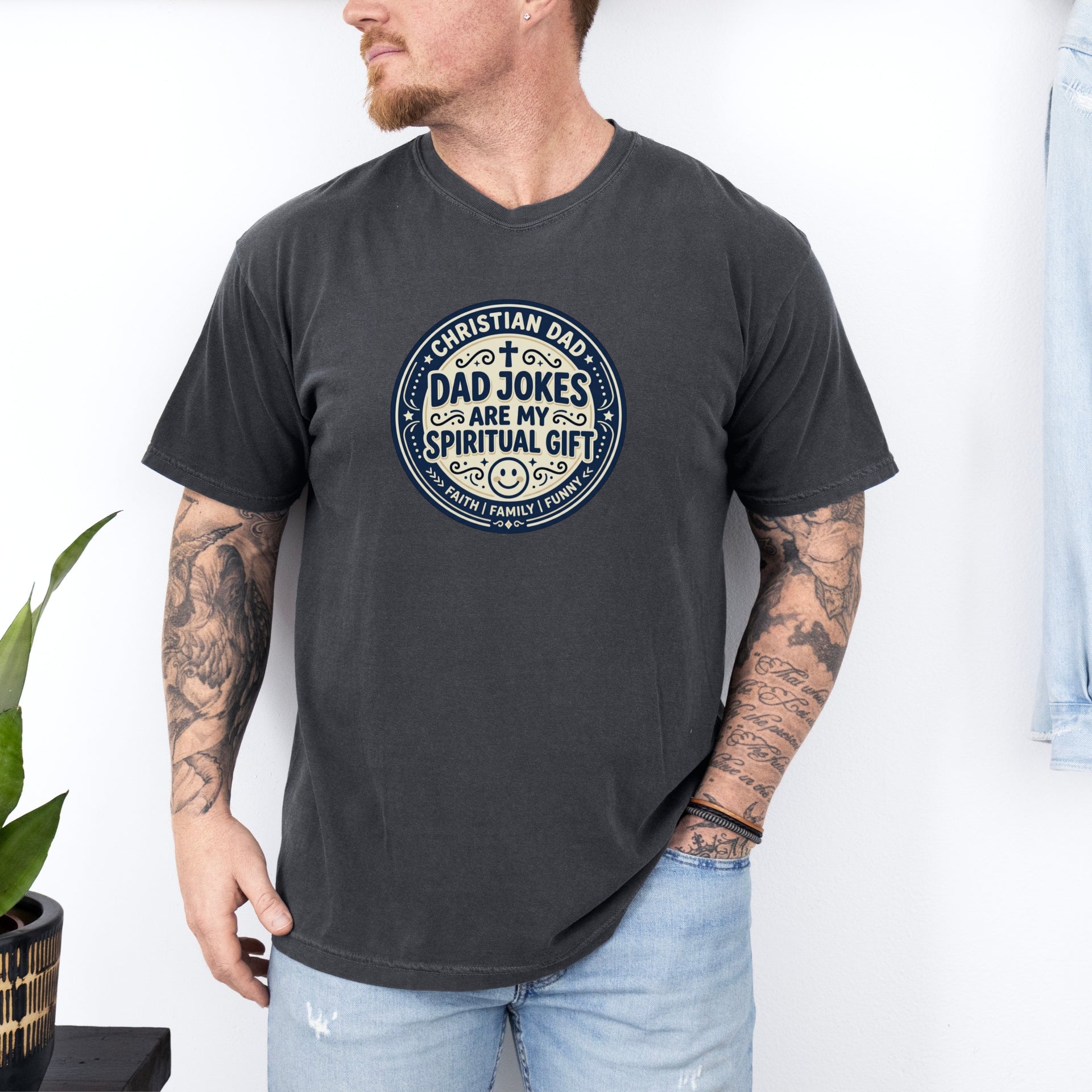 Man wearing Christian Dad Jokes T Shirt with graphic saying 'Dad Jokes Are My Spiritual Gift'.