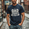 Dad Strength God First T-Shirt worn by a man outdoors, showcasing faith and strength in a casual style.