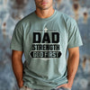 Dad Strength God First T-Shirt worn by a man, showcasing its Christian message and comfortable fit.