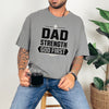 Dad Strength God First T-Shirt worn by a man holding a cup, showcasing a stylish, faith-inspired graphic tee.