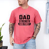 Man wearing a Dad Strength God First T-Shirt in pink, showcasing a strong Christian message.