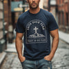 Faith Over Fear Trust In His Plan Comfort Colors T Shirt worn by a man, featuring a cross and mountain design.