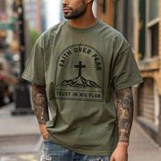 Man wearing Faith Over Fear Trust In His Plan Comfort Colors T Shirt, showcasing faith and courage in a city setting.