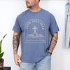 Faith Over Fear Trust In His Plan Comfort Colors T Shirt worn by man with tattoos, blue tee with cross and mountains design.