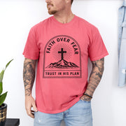 Faith Over Fear Trust In His Plan Comfort Colors T Shirt worn by a man, featuring a cross and mountains design.