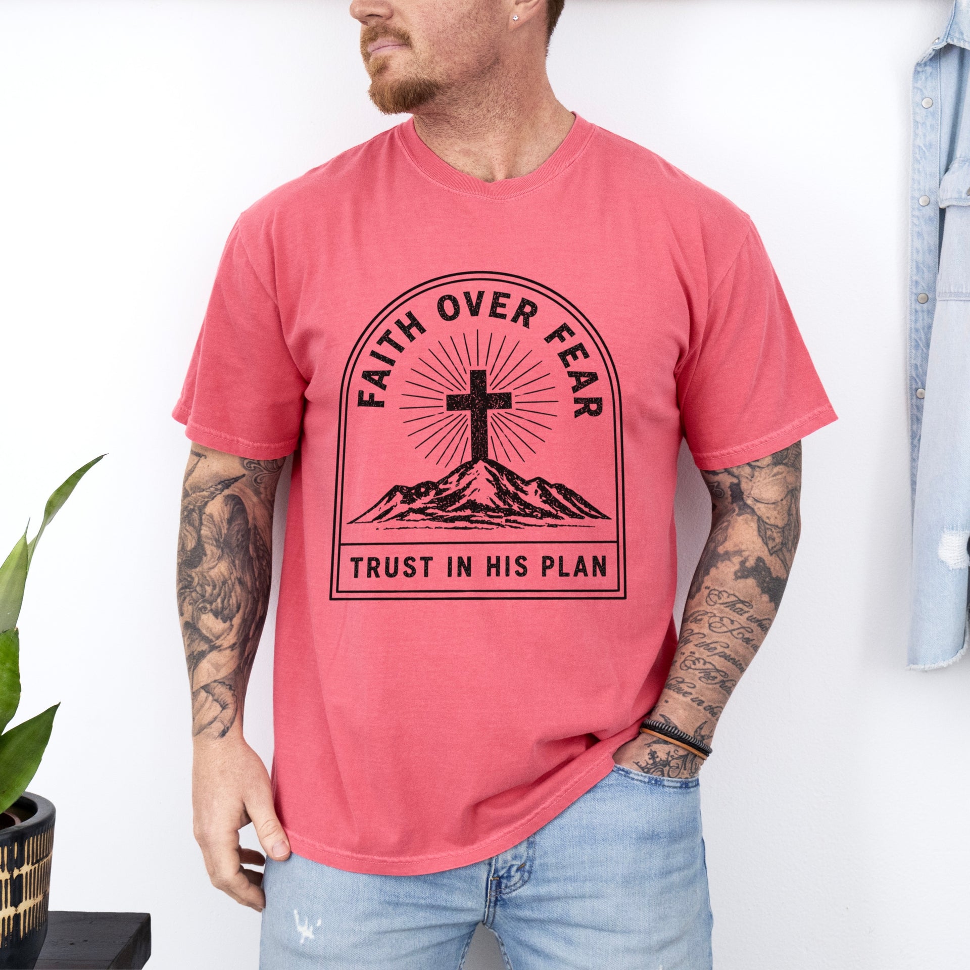 Faith Over Fear Trust In His Plan Comfort Colors T Shirt worn by a man, featuring a cross and mountains design.