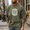 Man Of God Husband Father Leader T Shirt worn by a man with tattoos, standing in an urban setting.