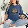 Woman wearing a 250 Years America Badge T-Shirt with a vintage badge design and American flag elements.