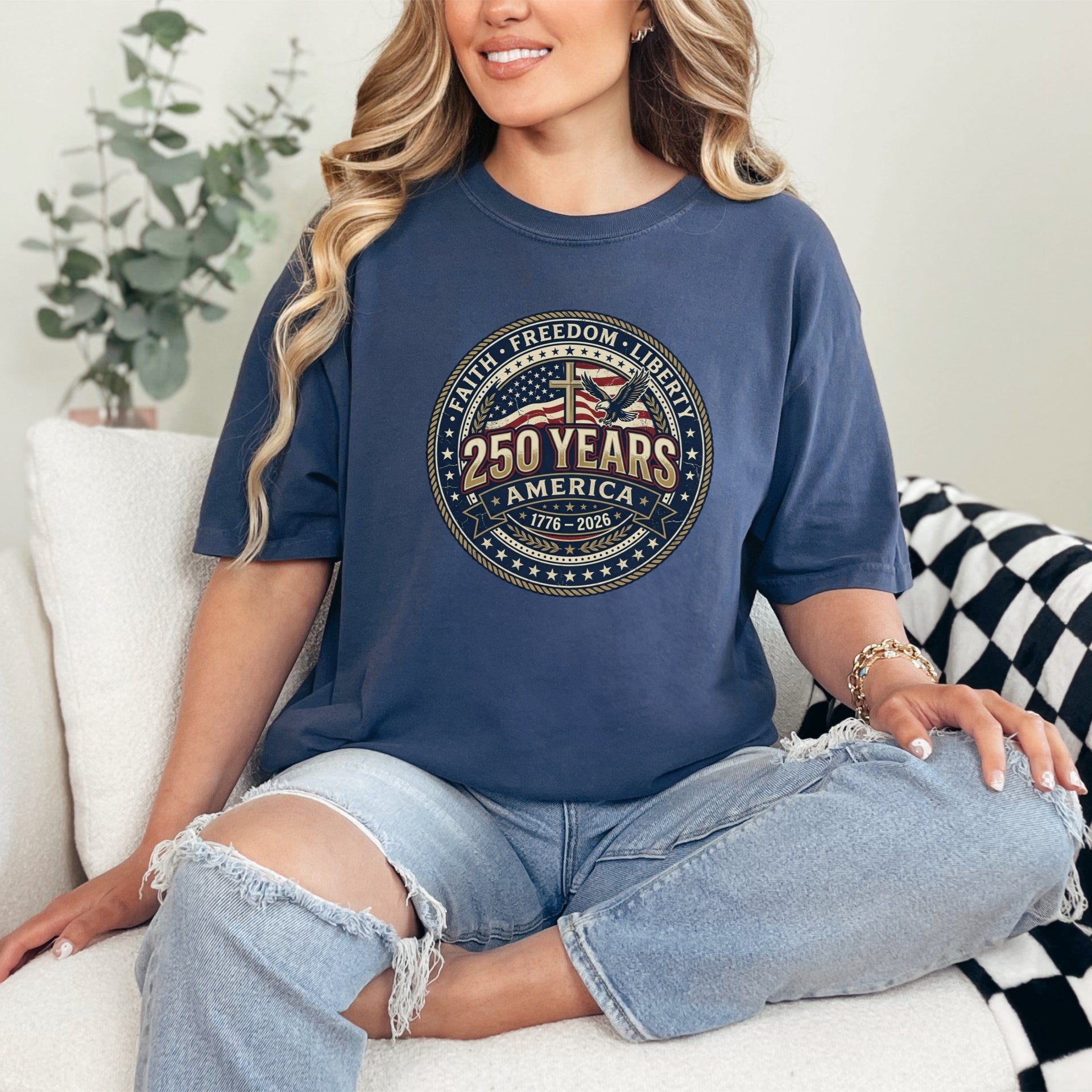 Woman wearing a 250 Years America Badge T-Shirt with a vintage badge design and American flag elements.