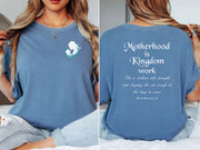 Motherhood Is Kingdom Work T Shirt featuring a silhouette of a mom and child on blue fabric.