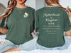 Motherhood Is Kingdom Work T Shirt featuring a mom and child silhouette on a light green tee.