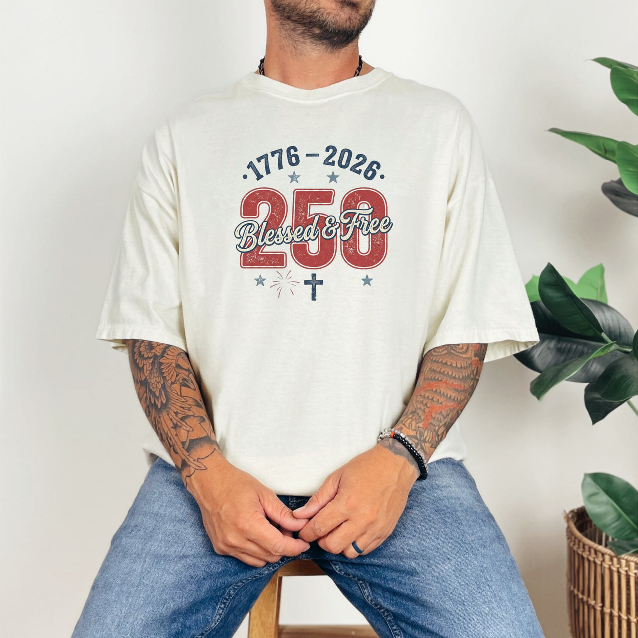 Man wearing a Blessed & Free 250 T-Shirt, celebrating freedom with a patriotic design and comfortable style.