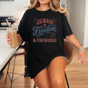 Woman wearing Jesus Freedom & Fireworks T-shirt while holding a drink, celebrating Independence Day.