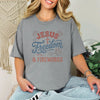 Jesus Freedom & Fireworks T-shirt worn by a smiling woman, perfect for Independence Day celebrations.