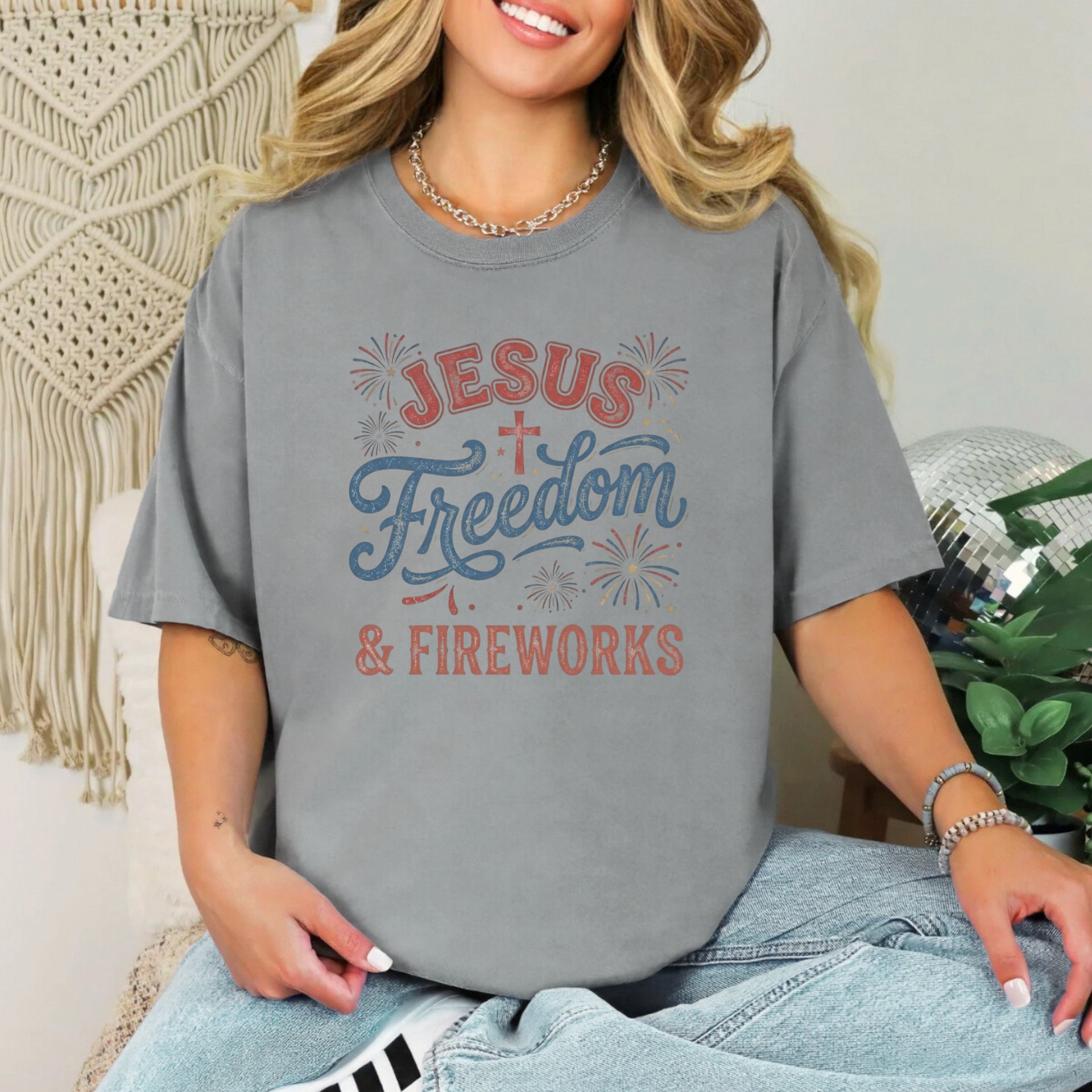 Jesus Freedom & Fireworks T-shirt worn by a smiling woman, perfect for Independence Day celebrations.