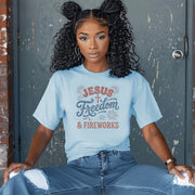 Jesus Freedom & Fireworks T-shirt showcased on a model wearing a light blue tee, celebrating faith and patriotism.