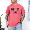 Blessed Dad Cross T Shirt featuring a bold cross design, worn by a man with tattoos in a casual setting.