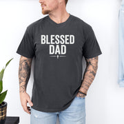 Man wearing a Blessed Dad Cross T Shirt featuring a bold design, celebrating faith and fatherhood.