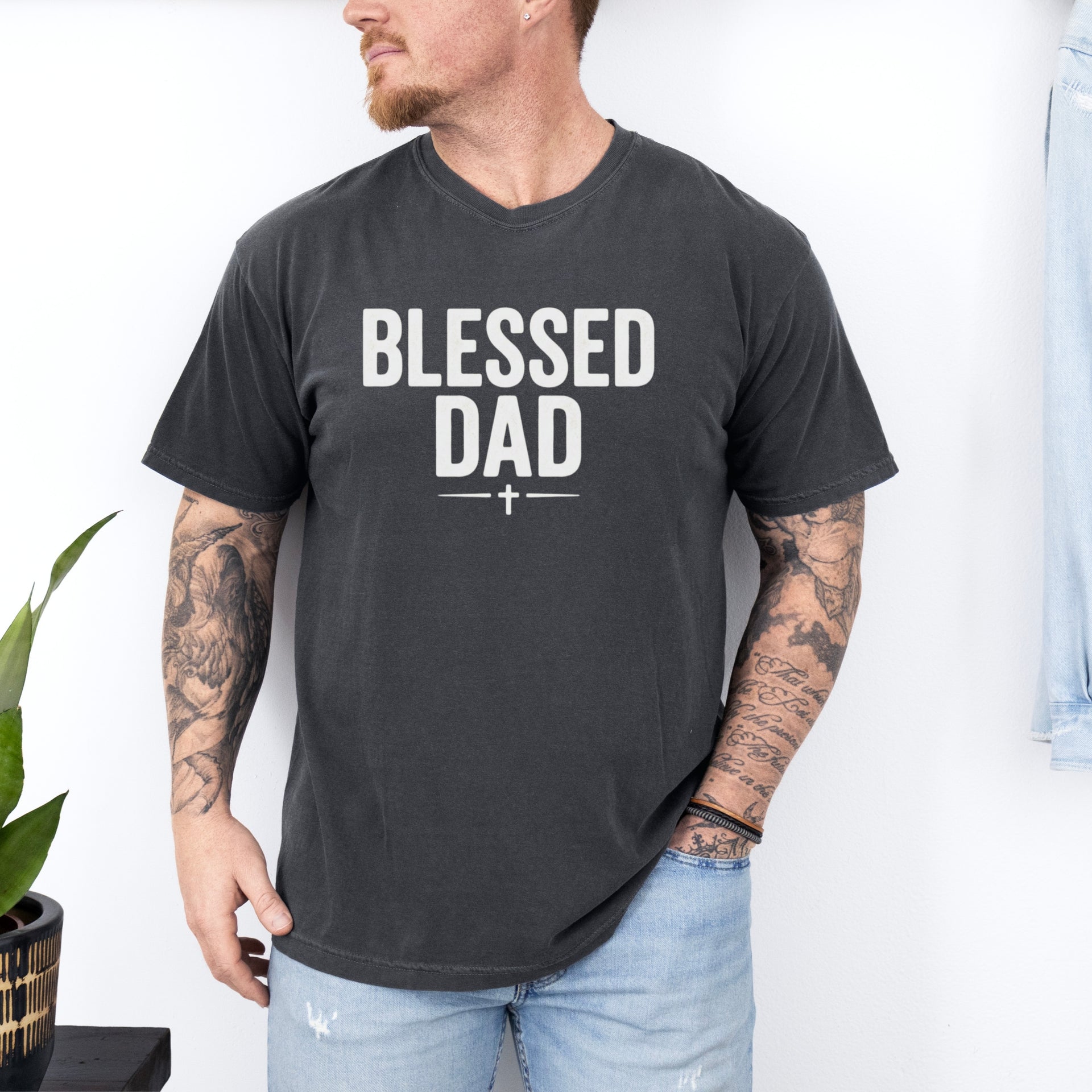 Man wearing a Blessed Dad Cross T Shirt featuring a bold design, celebrating faith and fatherhood.