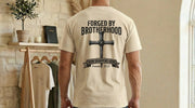 Back view of a man wearing a Forged By Brotherhood Cross T Shirt, showcasing Christian brotherhood apparel with a bold cross graphic.