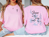 Jesus living water t shirt featuring pink color with scripture design and cross embellishment