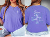 Jesus living water t shirt on a model, featuring a cross on the front and a colorful design on the back with scripture.