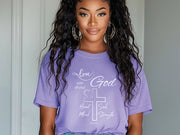 Model wearing a purple Love God T Shirt with scripture design, showcasing faith and style.