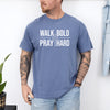 Man wearing Walk Bold Pray Hard Christian cross t shirt, showcasing bold design and relaxed fit.