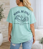 Peace Be Still T Shirt design featuring waves and a cross, emphasizing trust in God, on a soft mint green tee.