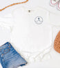 Peace Be Still T Shirt displayed with denim shorts and casual accessories, emphasizing comfort and style.
