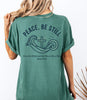 Peace Be Still T Shirt design featuring waves and a cross, symbolizing calm and trust in God.