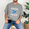 Person wearing a Faith > Fear T shirt, promoting faith over fear t shirt with a relaxed style.